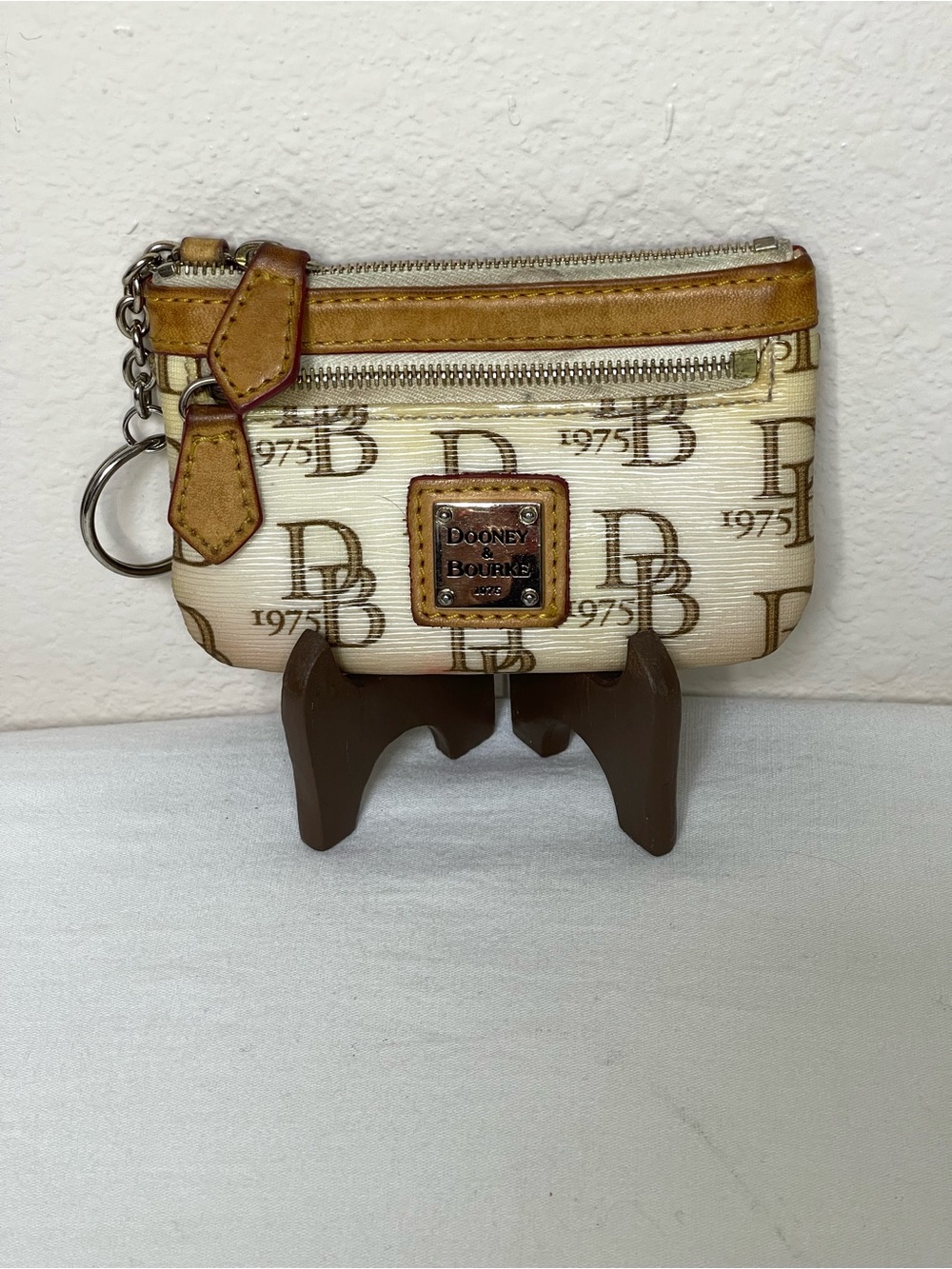 This Dooney & Bourke 1975 Signature Monogram Coin Purse and Key Chain